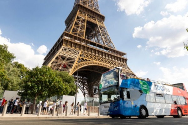 Tootbus Paris hop-on, hop-off bus in Paris in front of Eiffel Tower