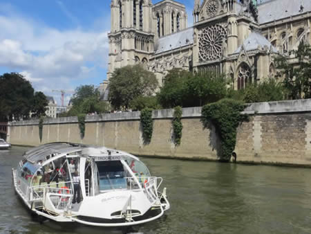 River bus outside Notre Dame Cathedral Paris